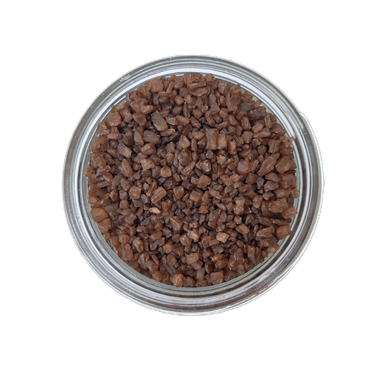 a bowl of brown crystals