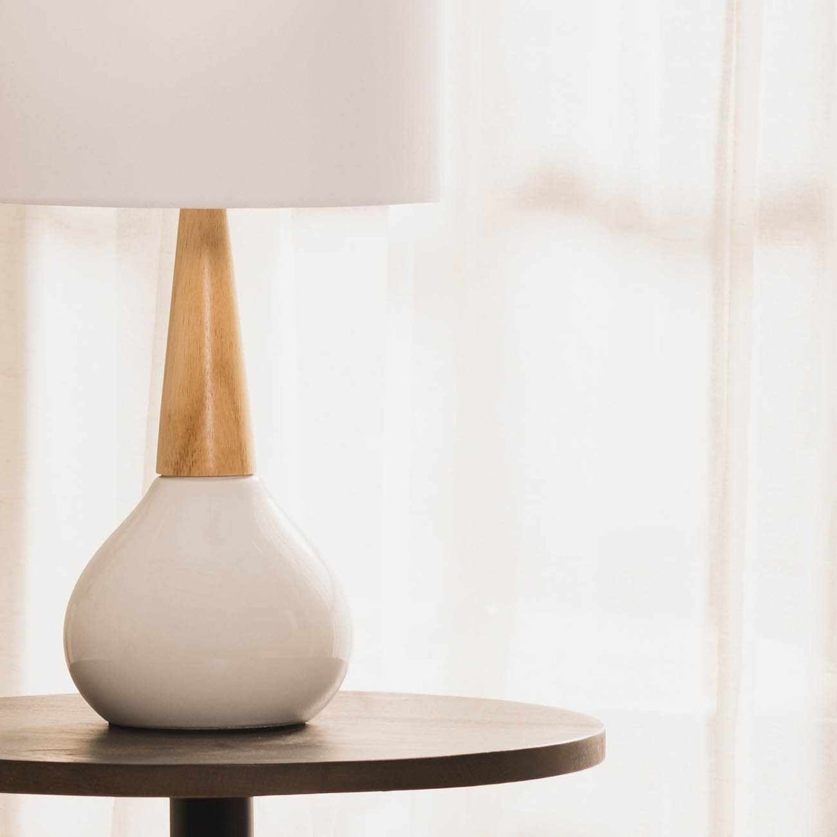 a white lamp on a table