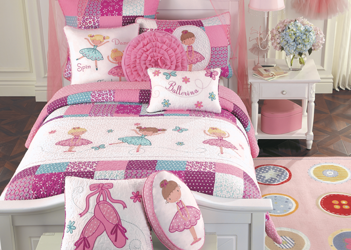 a bed with pink and white bedding