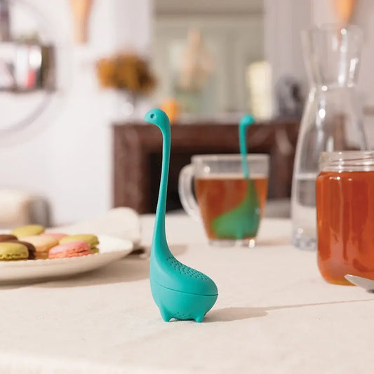 a tea strainer on a table