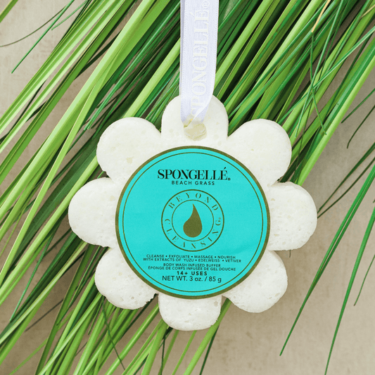 a white flower shaped object with a blue label on it