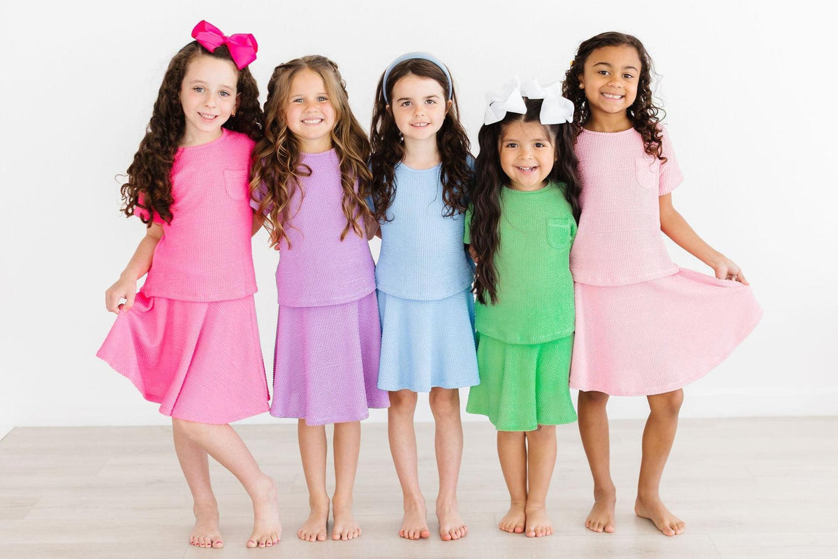 a group of girls in different colors