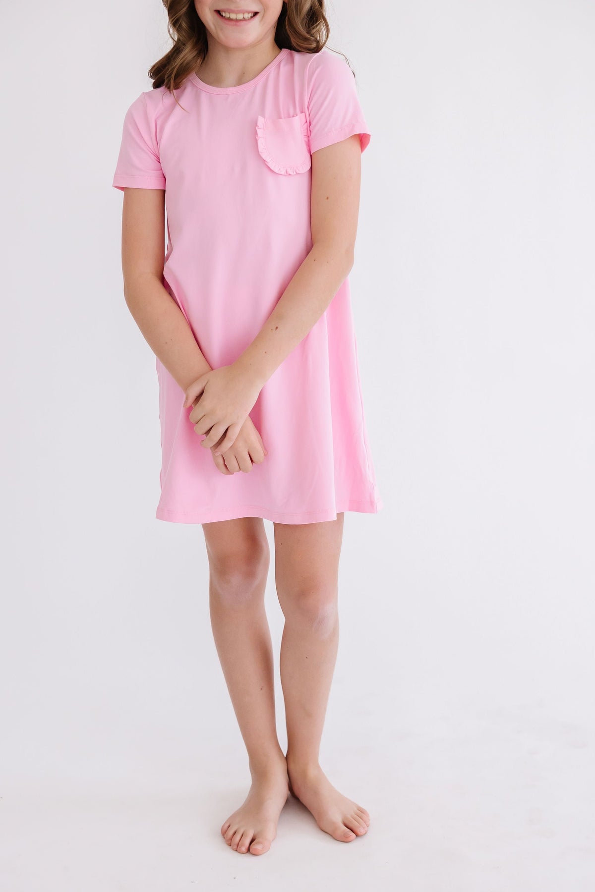 a girl in a pink dress