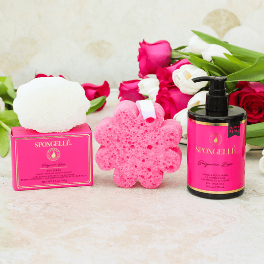 a pink box and a sponge next to a pink flower