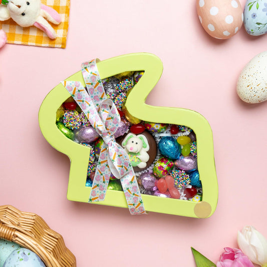 a basket of candy and eggs