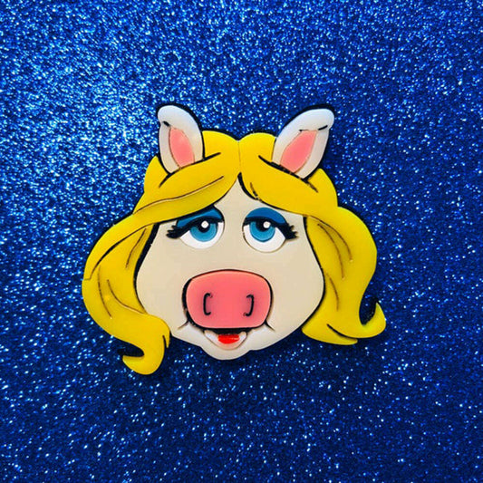 a cartoon piggy face on a blue background