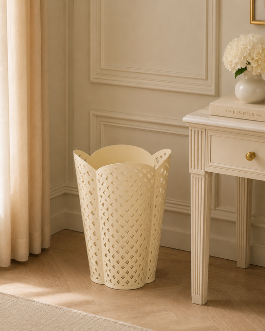 a white basket next to a table