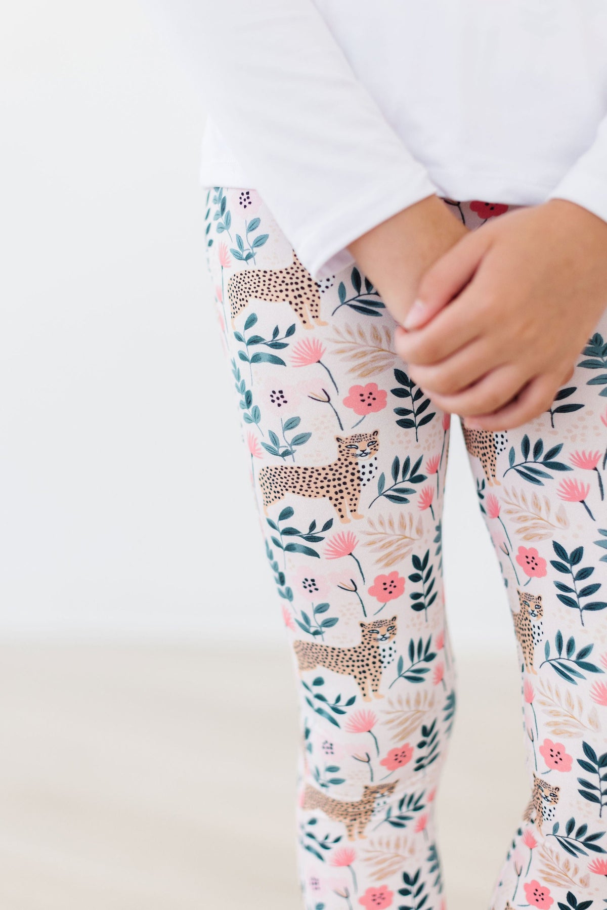 a person wearing floral leggings