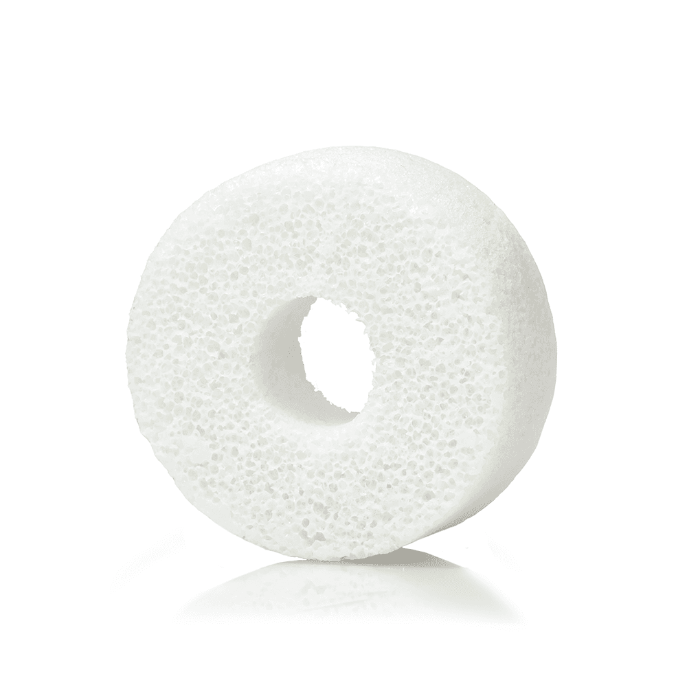 a white round object with a hole in the middle