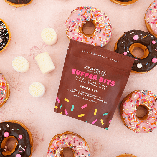 a group of donuts with a packet of sugar
