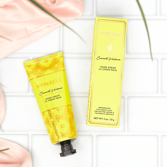 a yellow tube of cream next to a pink towel