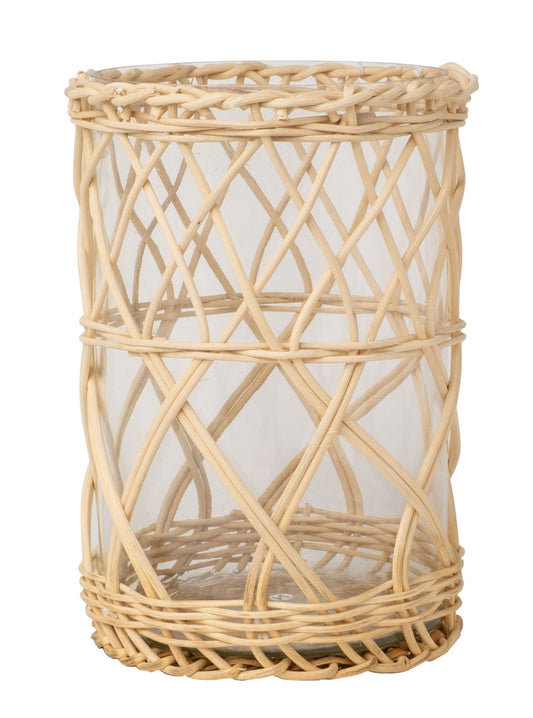 a wicker basket with a glass inside