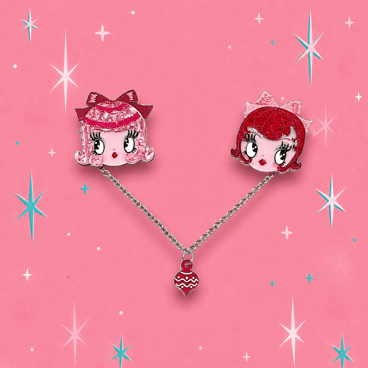 a pair of earrings with cartoon characters on them
