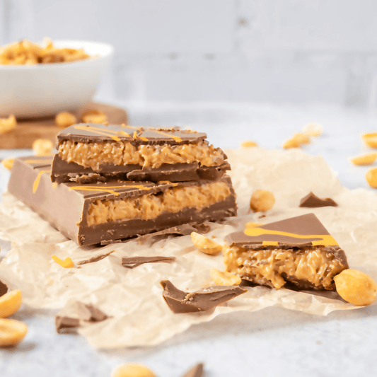 a chocolate bar with peanut butter and peanuts
