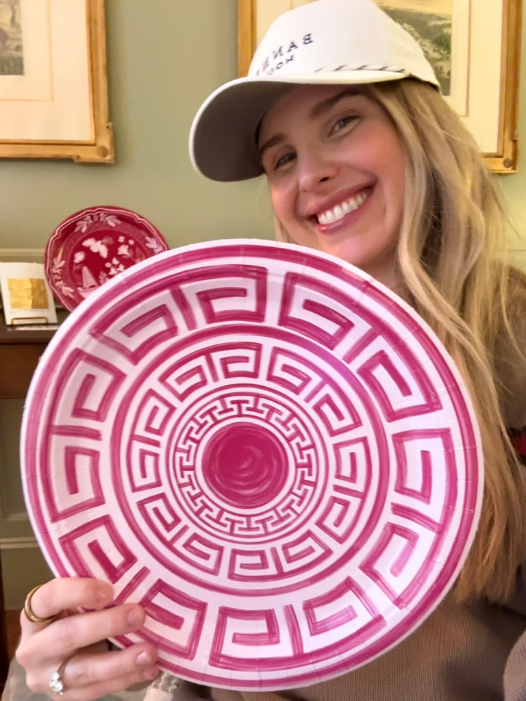 a woman holding a plate