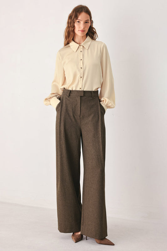 a woman with her hands in her pockets