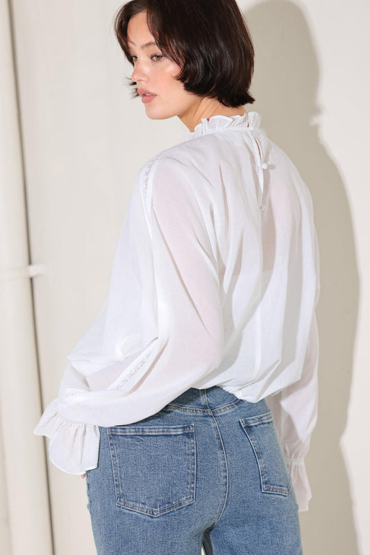 a woman in a white shirt