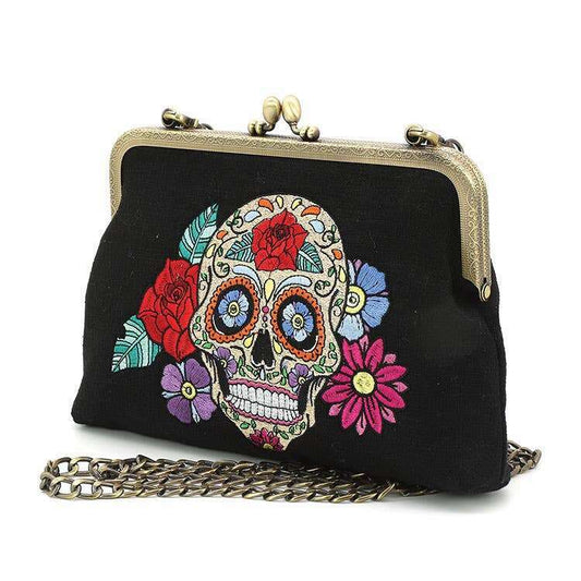a black purse with a skull on it