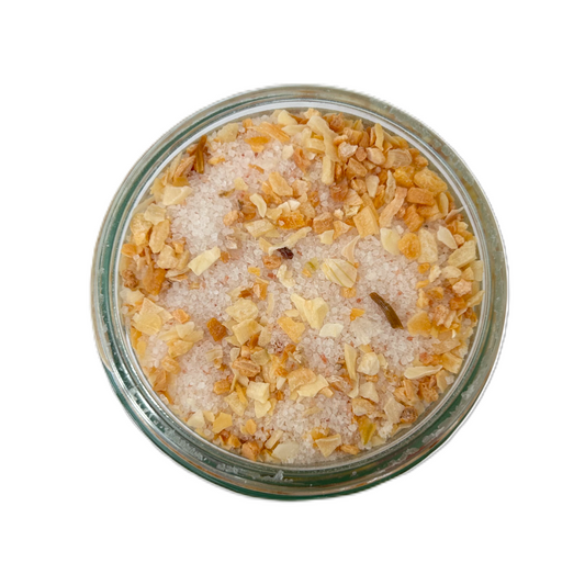 a glass jar with salt and spices