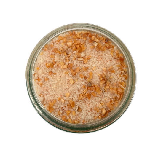 a bowl of salt and brown crystals