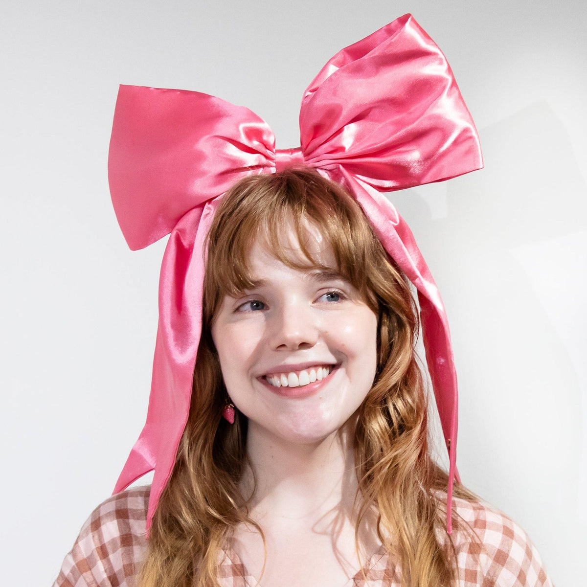 a woman with a large bow on her head