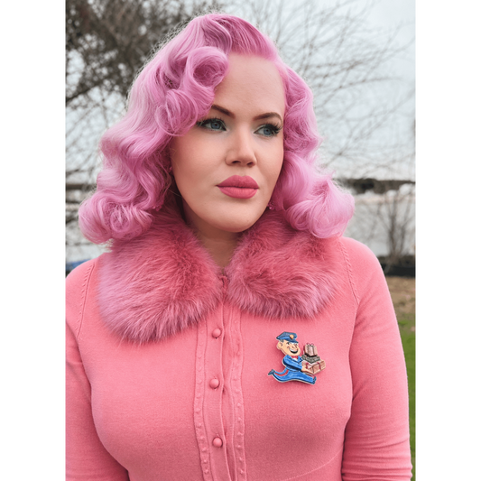 a woman with pink hair and a pink fur collar
