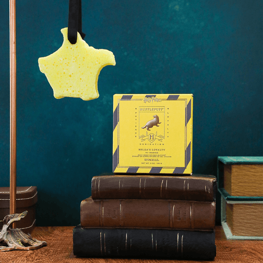 a yellow star from a string on a stack of books