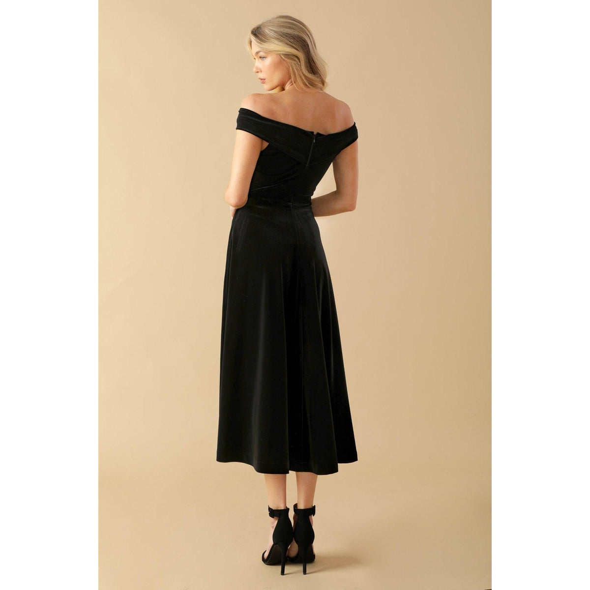 a woman in a black dress