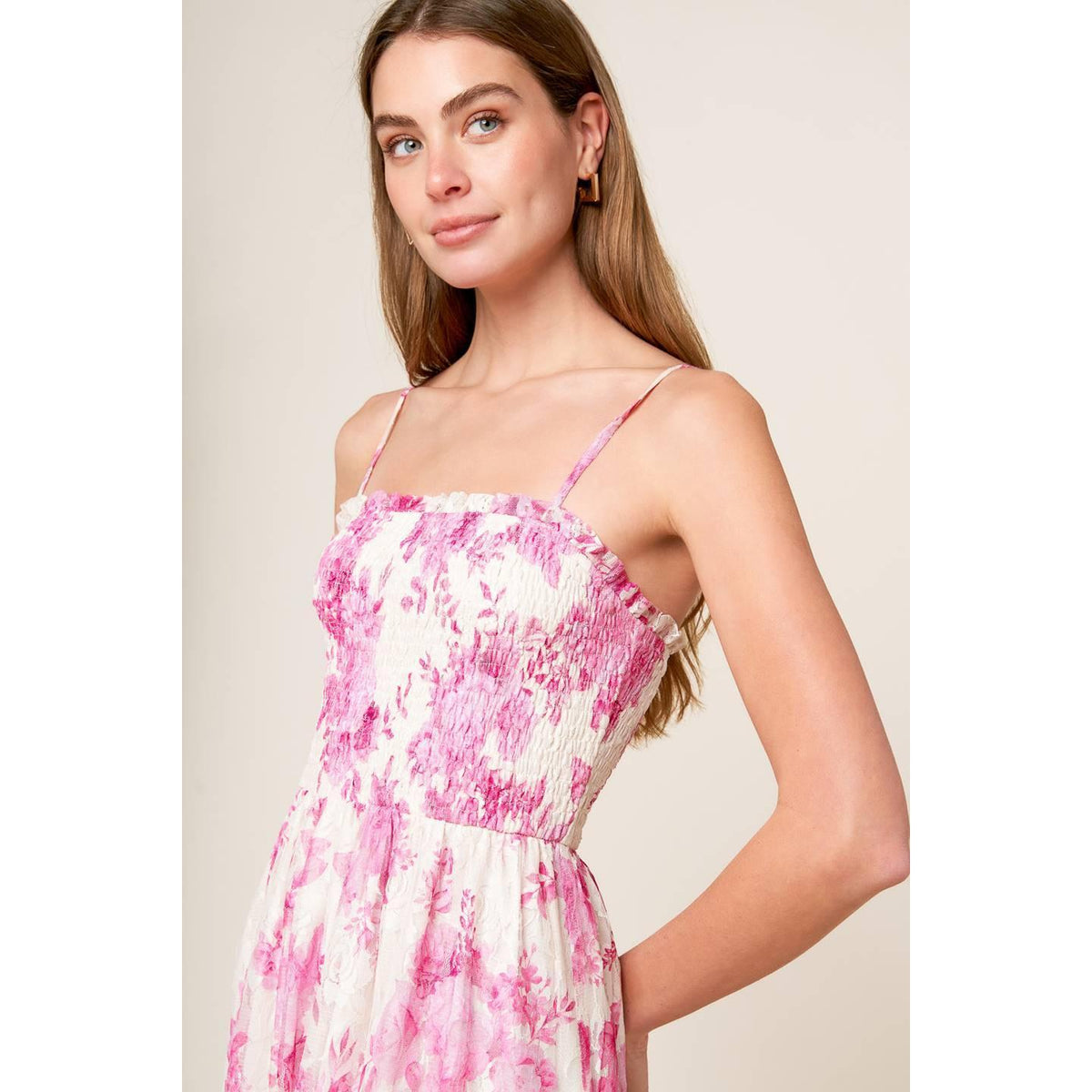 a woman in a pink and white dress