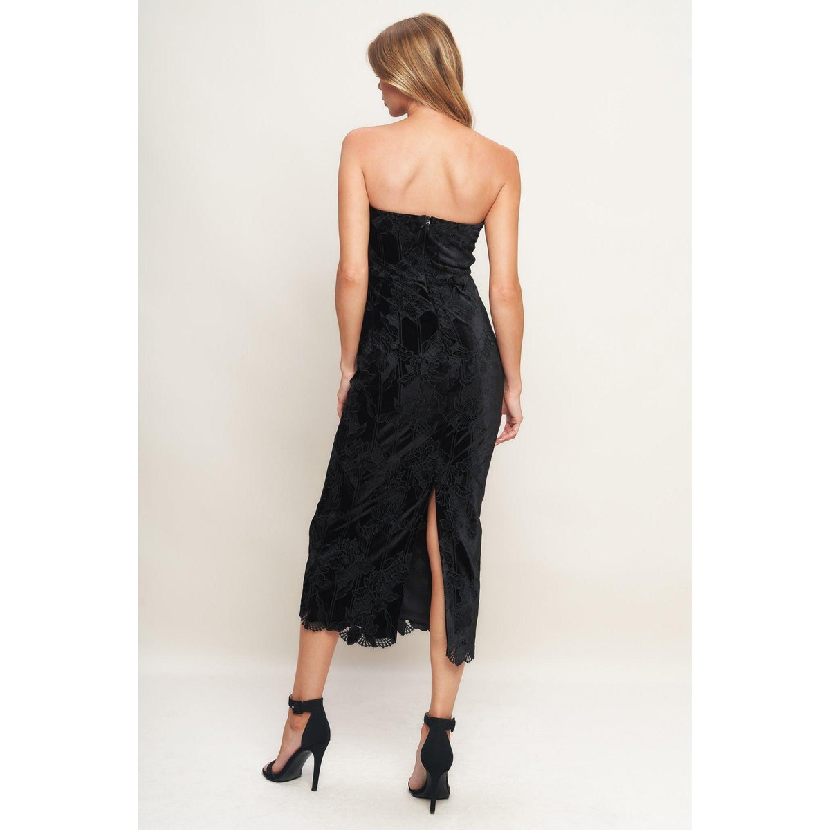 a woman in a black dress