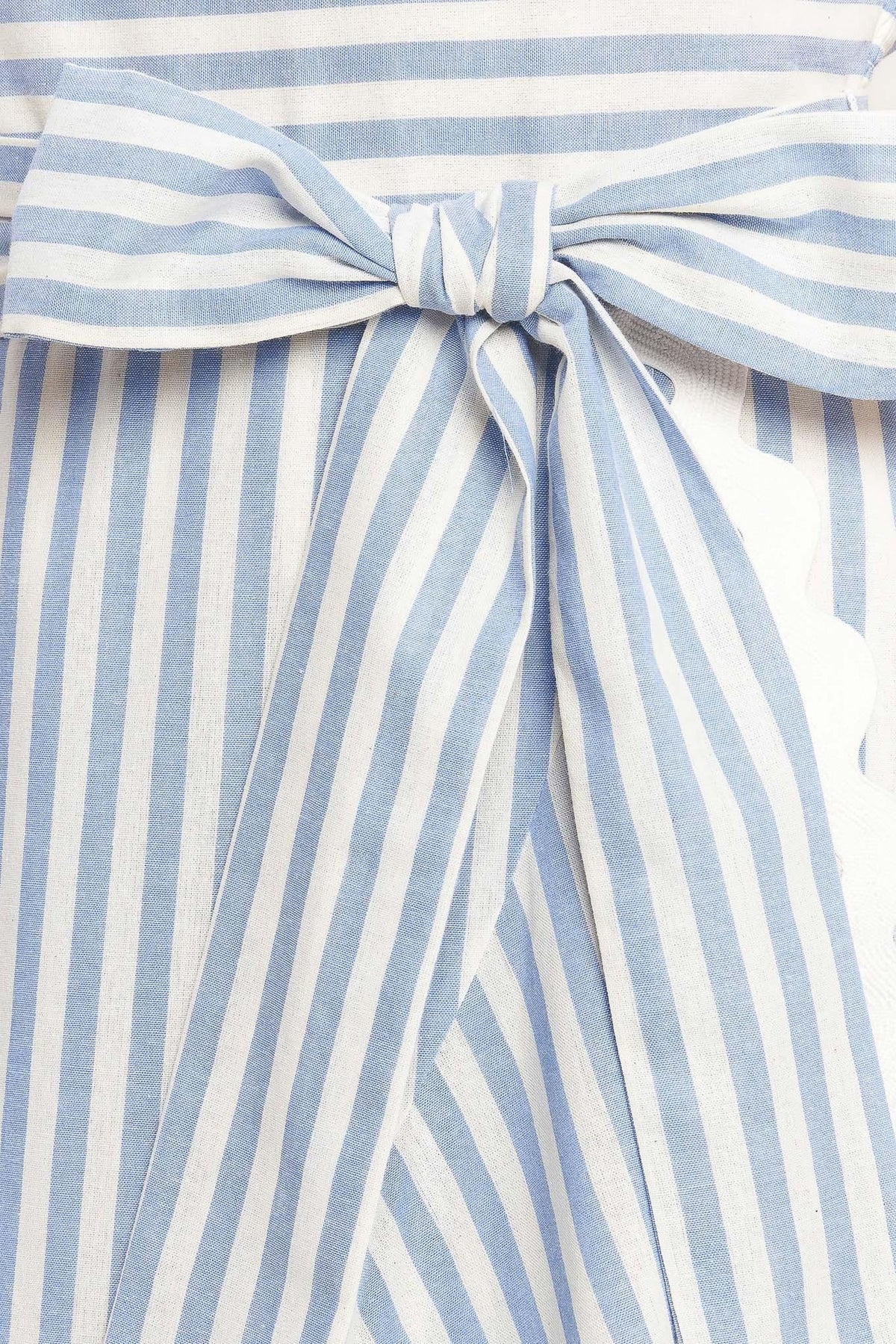 a blue and white striped shirt with a bow