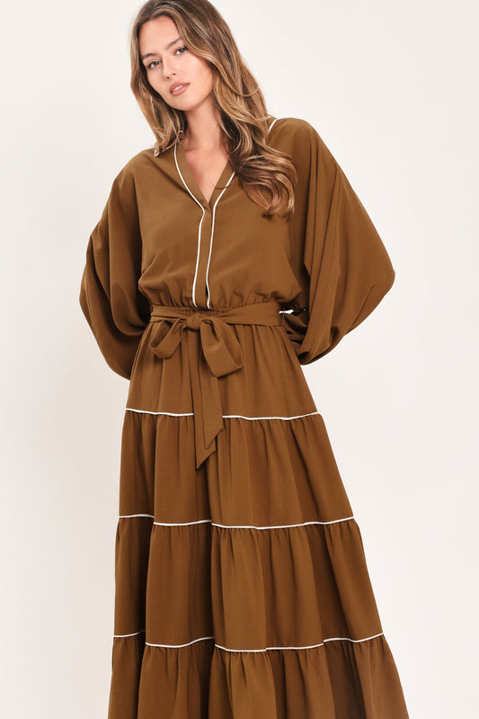 a woman in a brown dress