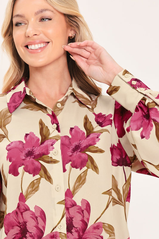 a woman smiling with her hand on her chin