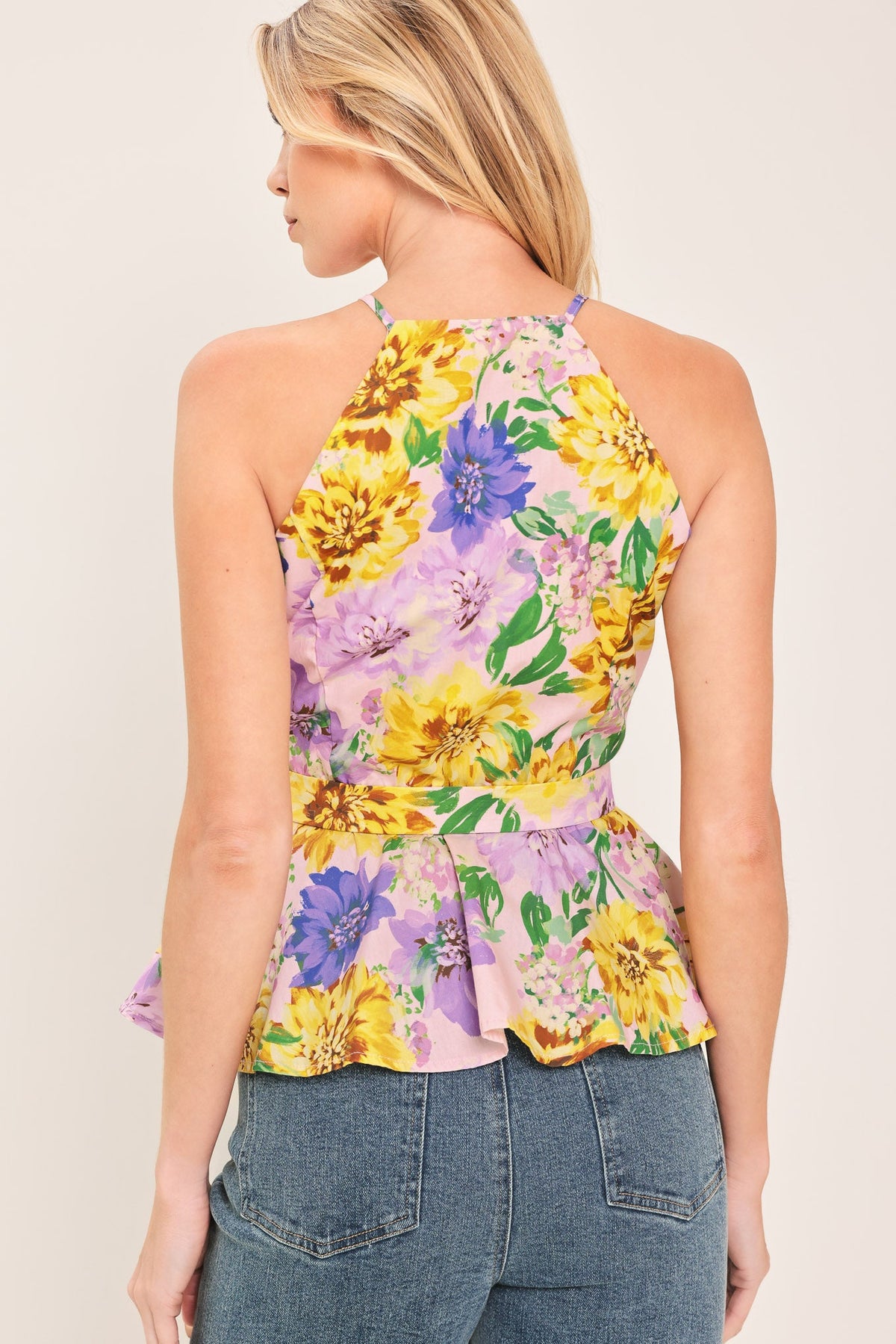 a woman wearing a floral top