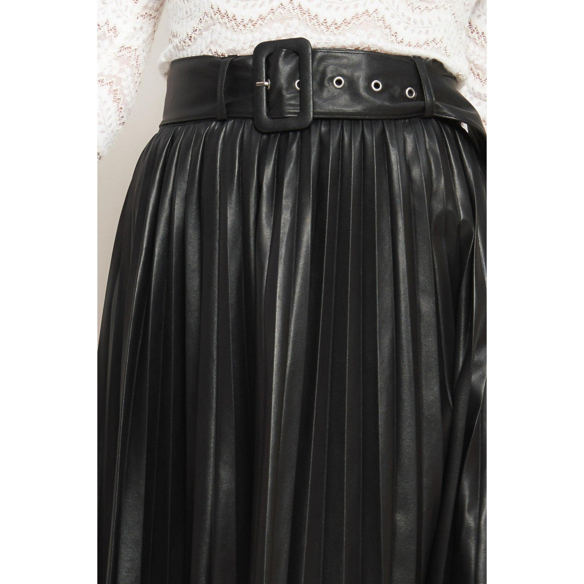 a woman wearing a black leather skirt