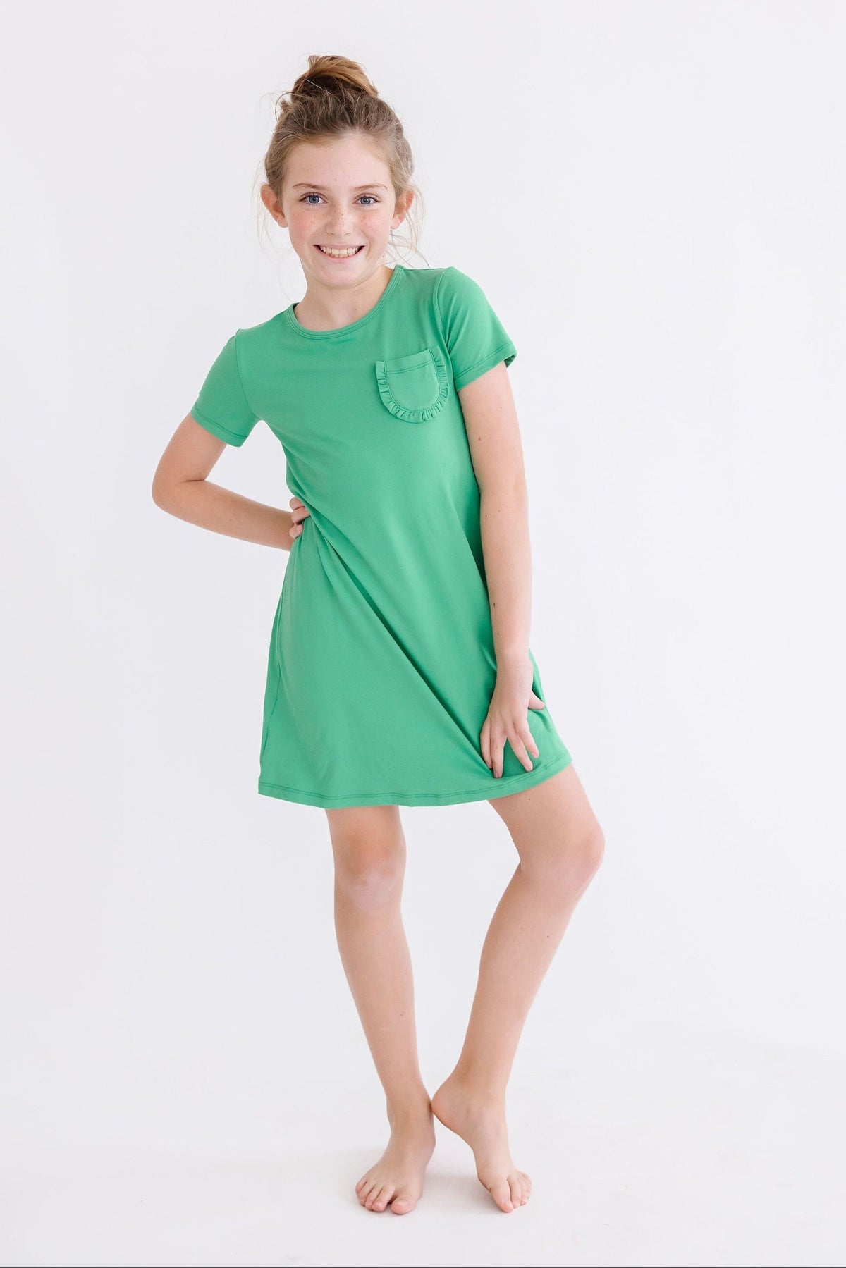 a girl in a green dress