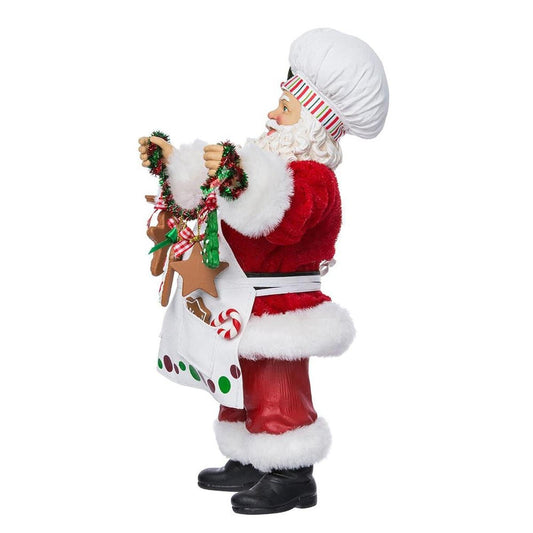 a santa claus holding a bag of gingerbread cookies