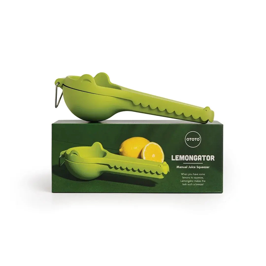 a green lemon squeezer on a box