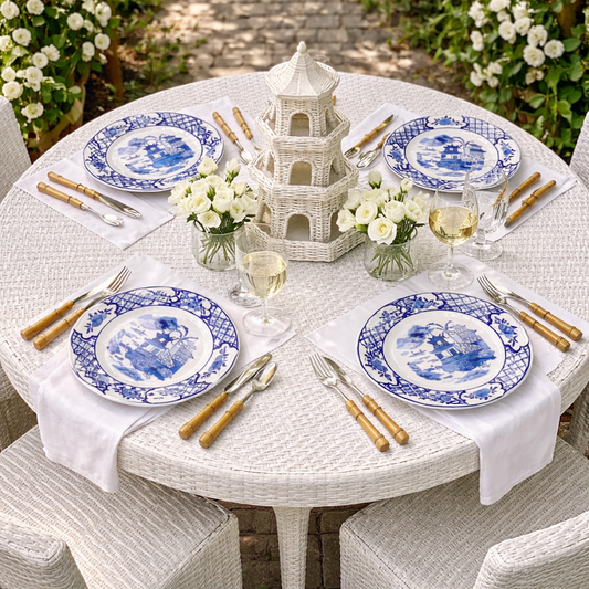 a table set with plates and silverware