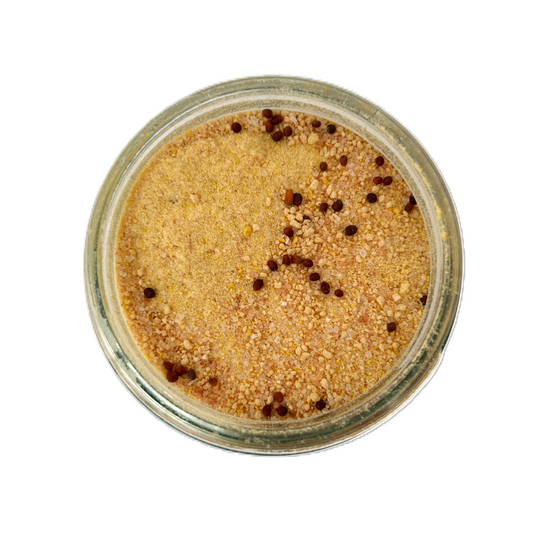 a jar of food with yellow and brown powder