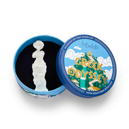a small white statue in a blue box