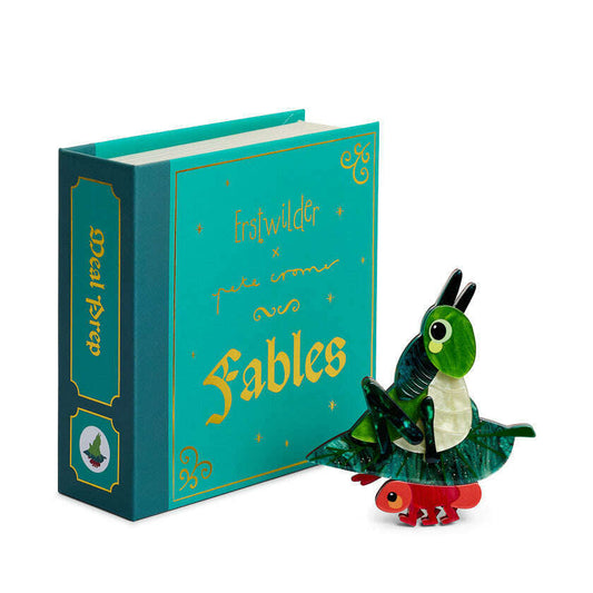 a book with a toy dragon on it