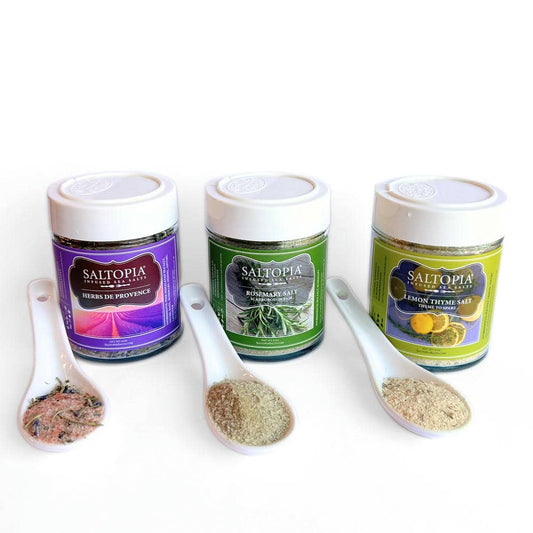 a group of containers with different colored containers and spoons