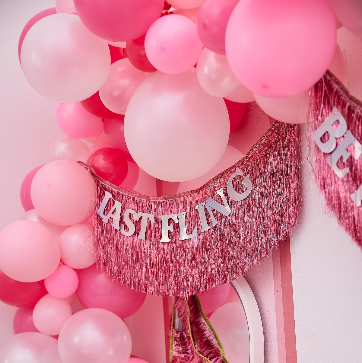 a pink and white balloons