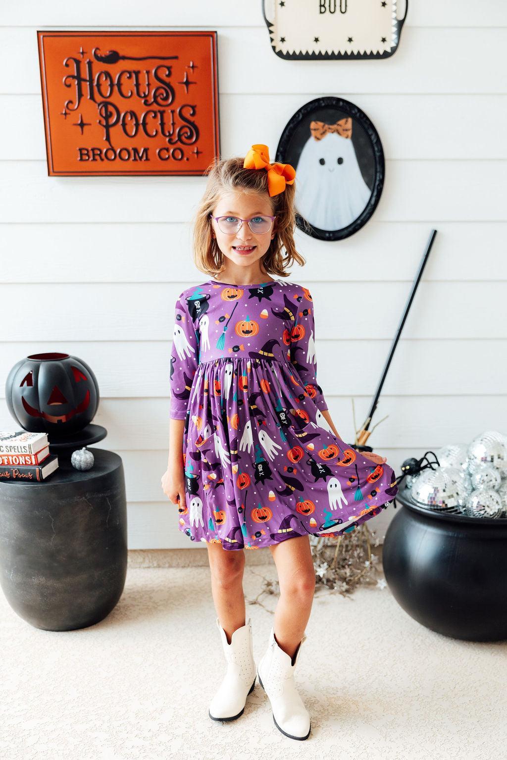 a girl in a purple dress