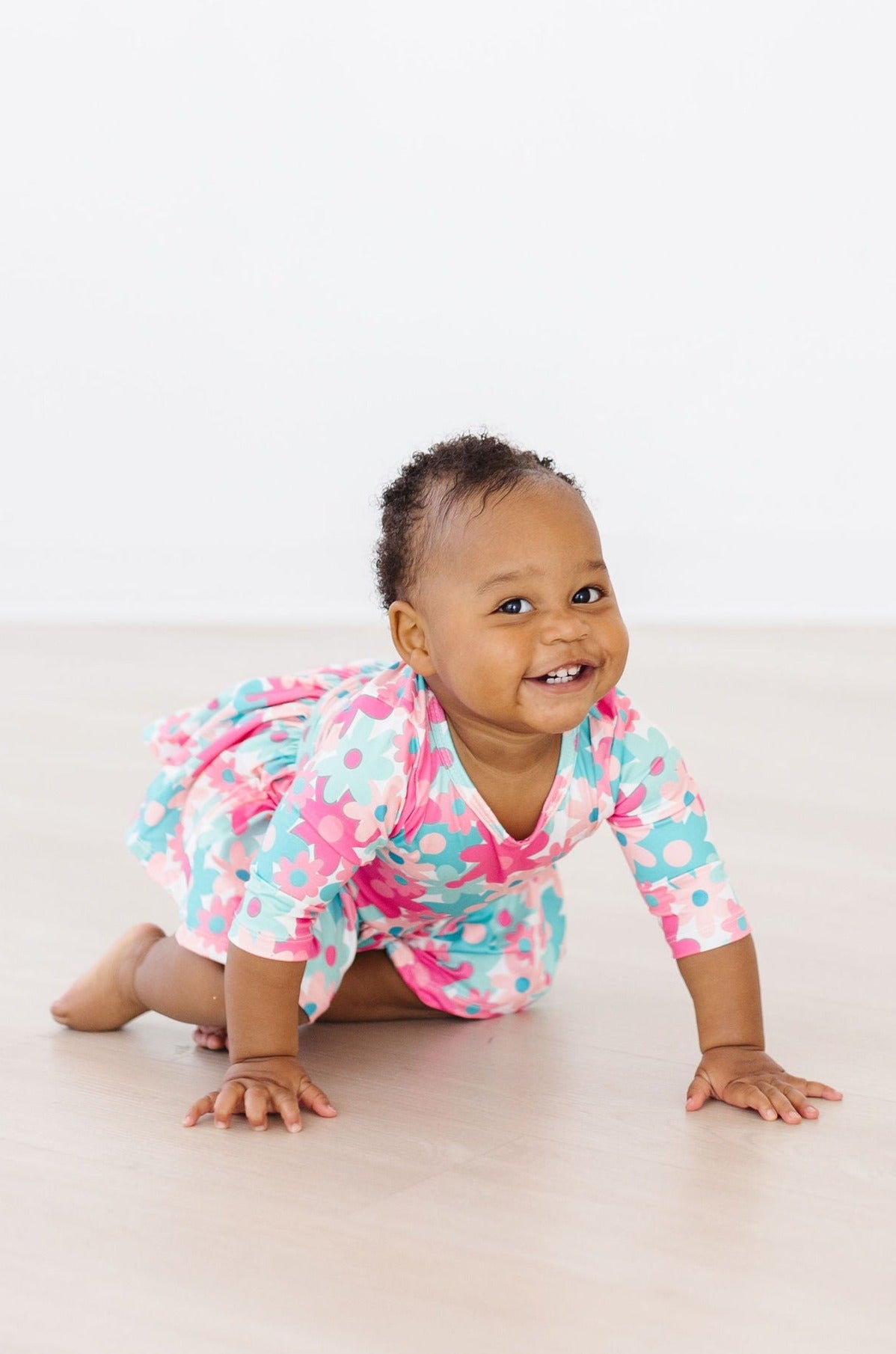 a baby crawling on the floor