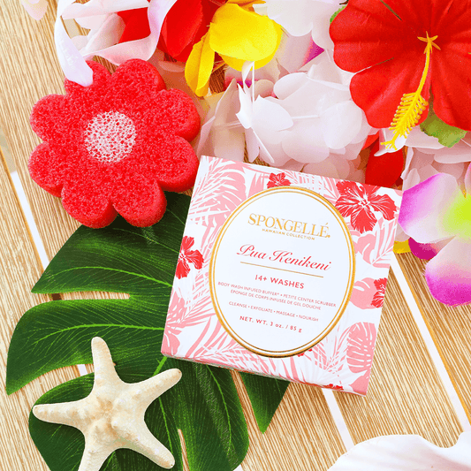 a box with a starfish and flowers on a table