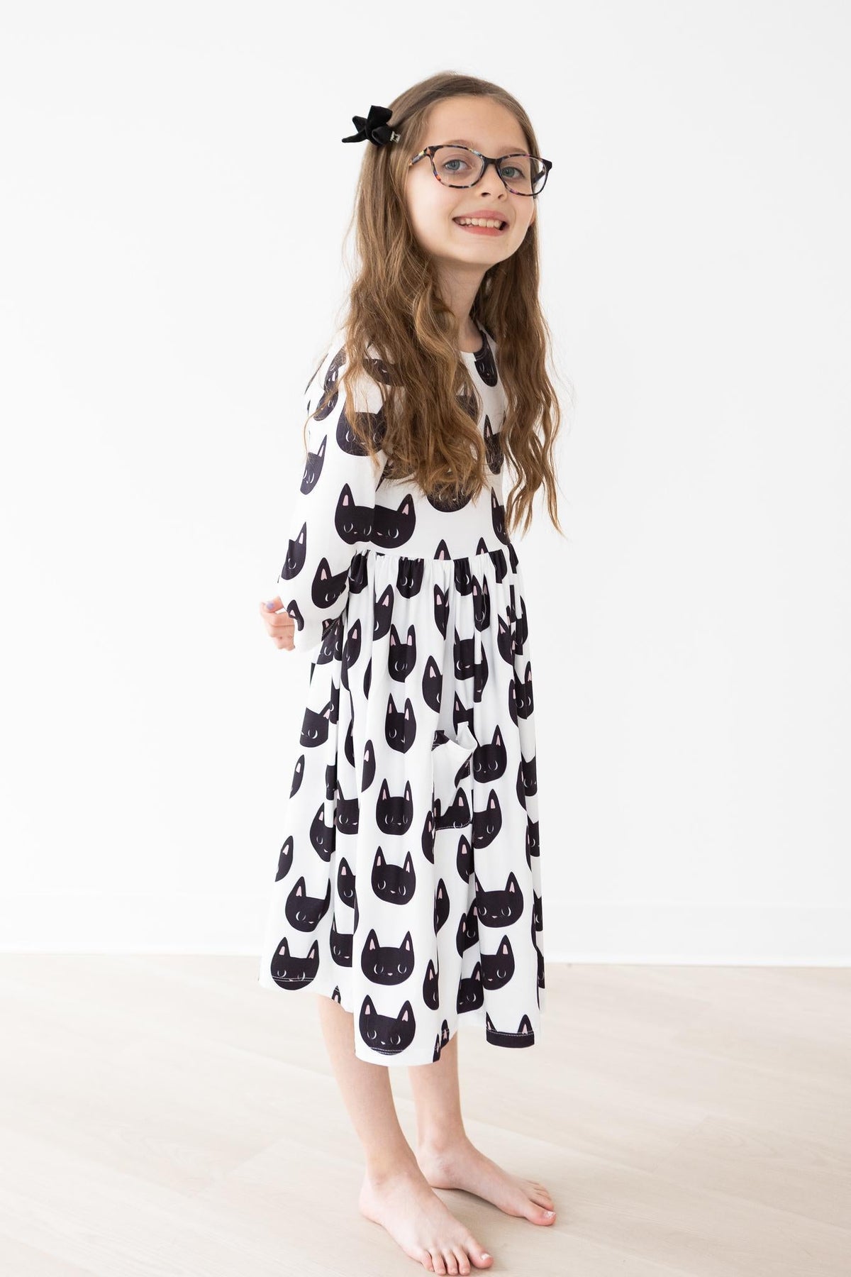 a girl in a cat dress