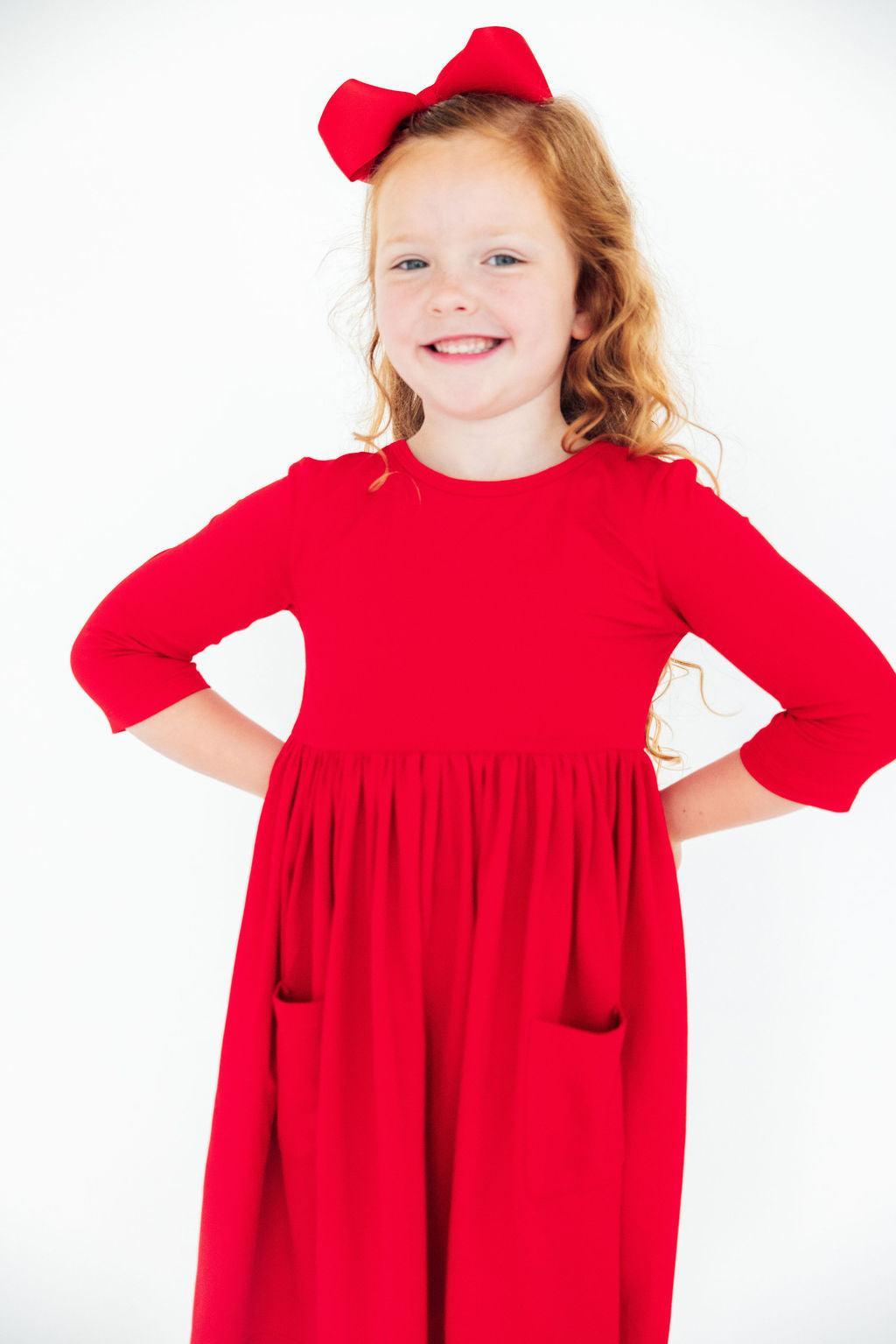 a girl in a red dress