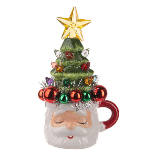 a mug with a christmas tree and a star on top
